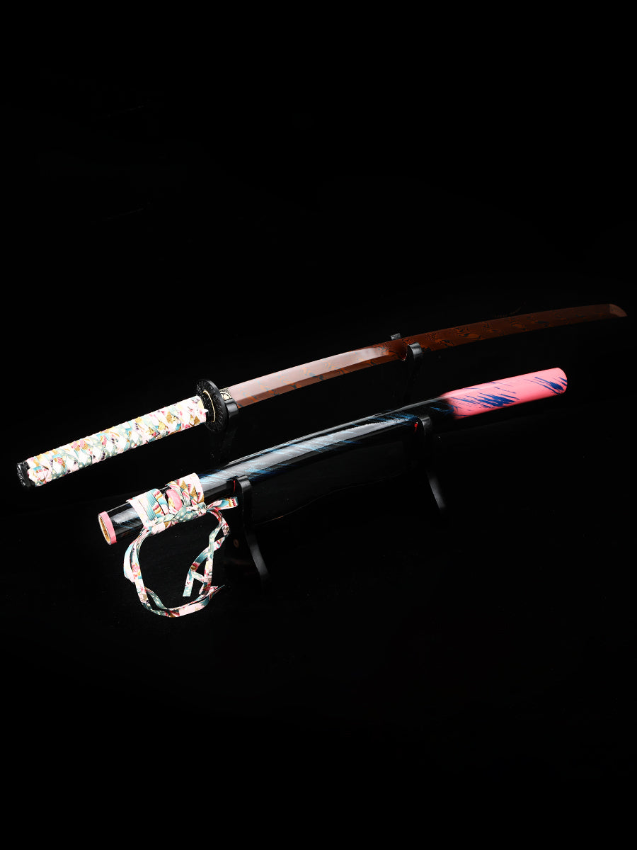 The hand-forged blade is crafted from pattern-welded steel, hammered and forged through countless strikes